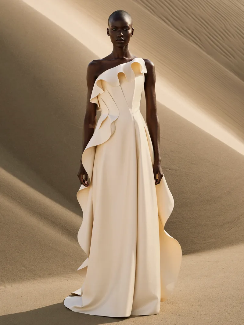 Look V, Volute — one-shoulder gown with a single continuous carved ruffle, lit by a blade of afternoon sun